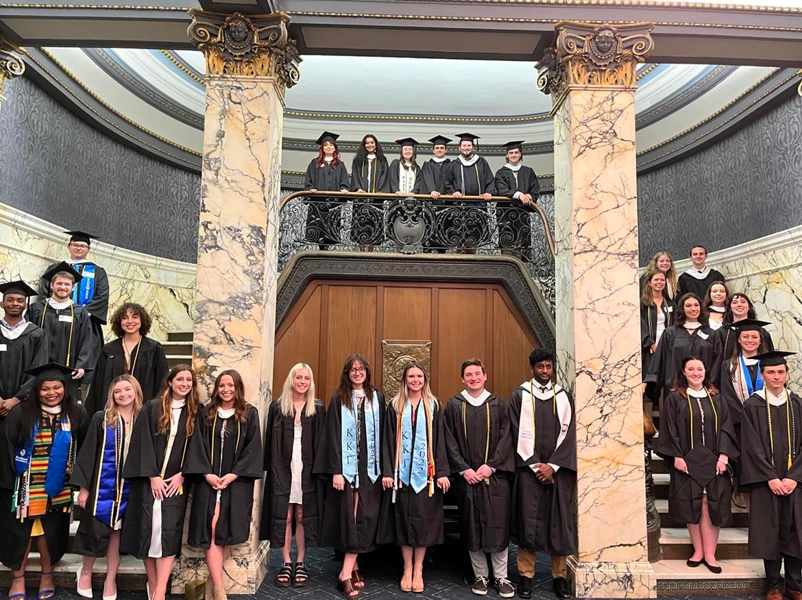 2022 Geology and Environmental Science graduates gathered for a group photo on staircase.