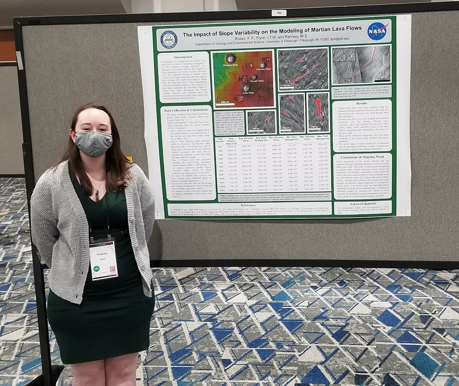 Frances Russo stands next to her research poster at the Lunar Planetary Science Conference