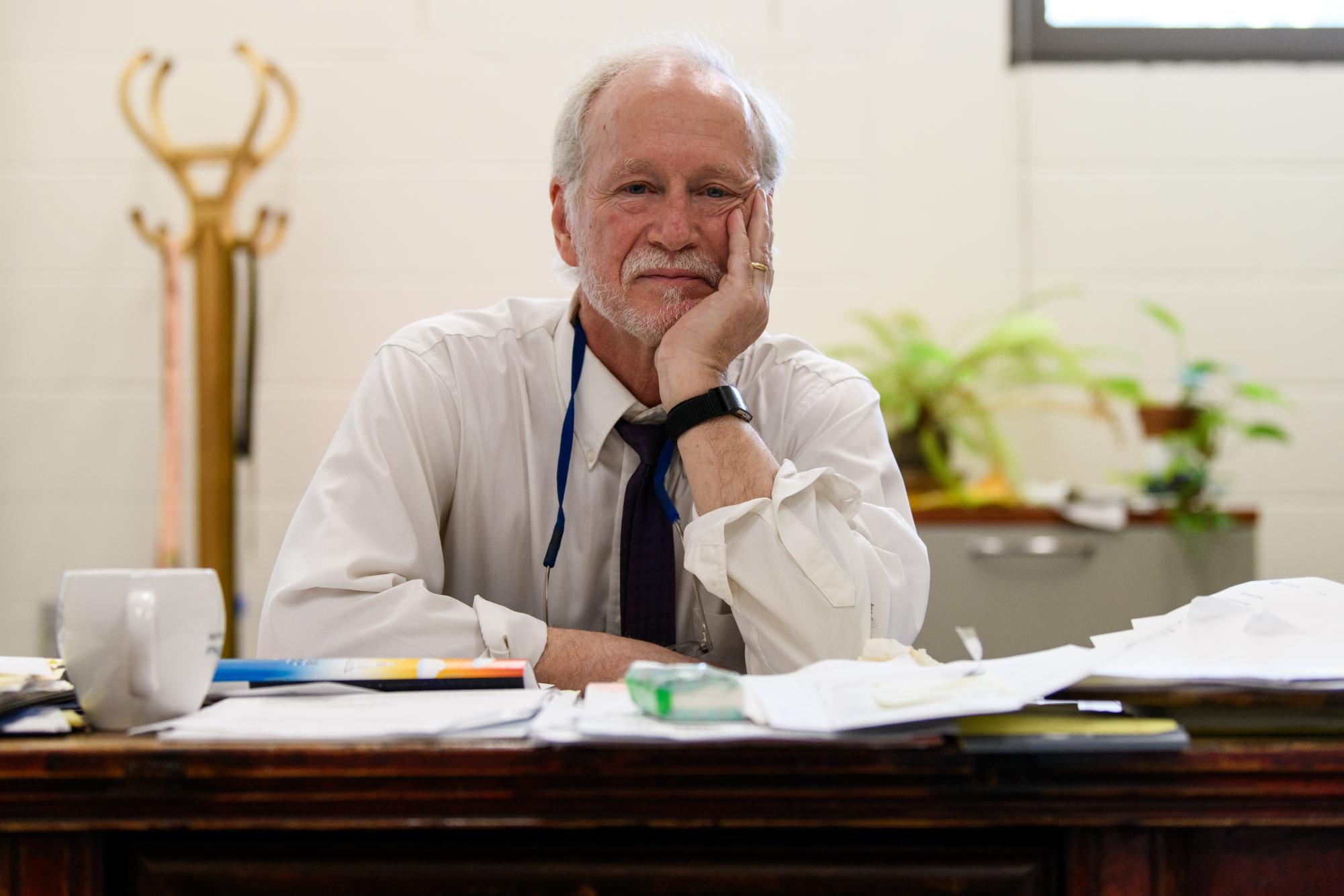 Image of man sitting at desk.