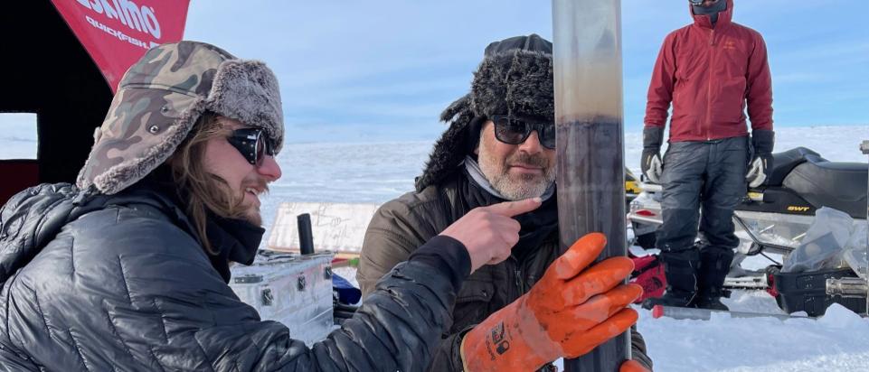 Faculty an student with ice core.