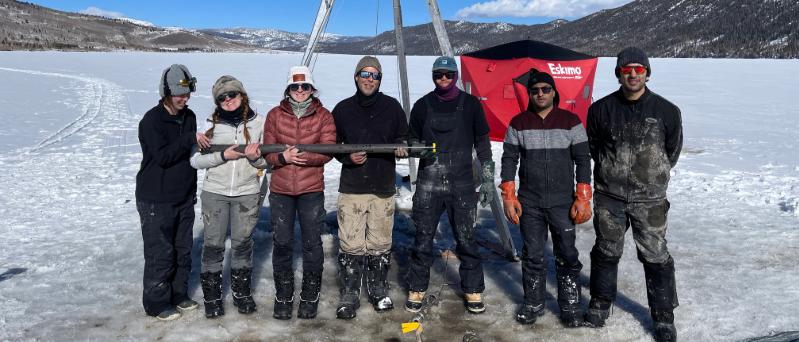 Scientists on frozen lake.